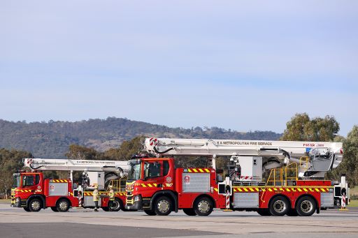 Two fire trucks next to each other.