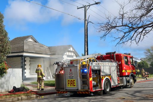 Fire truck in front of a house.