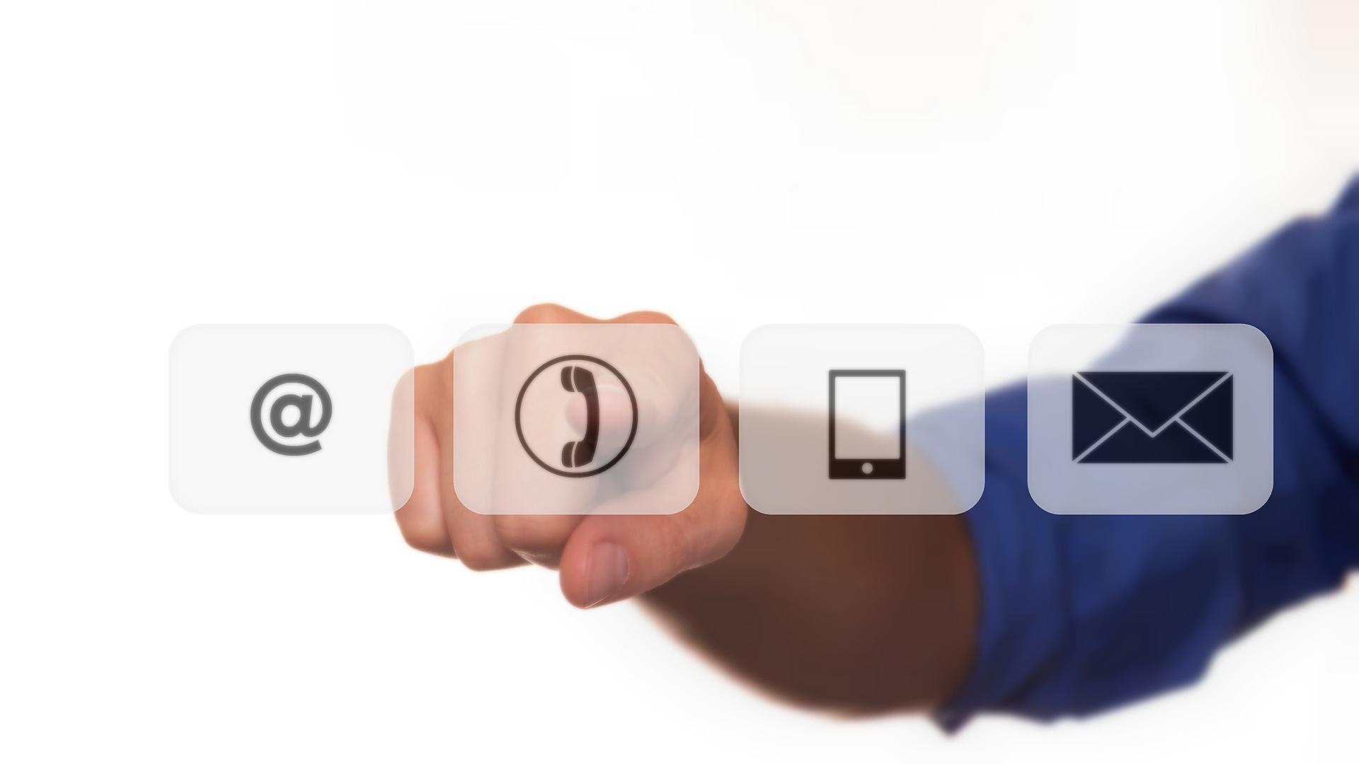 Hand pressing contact icons