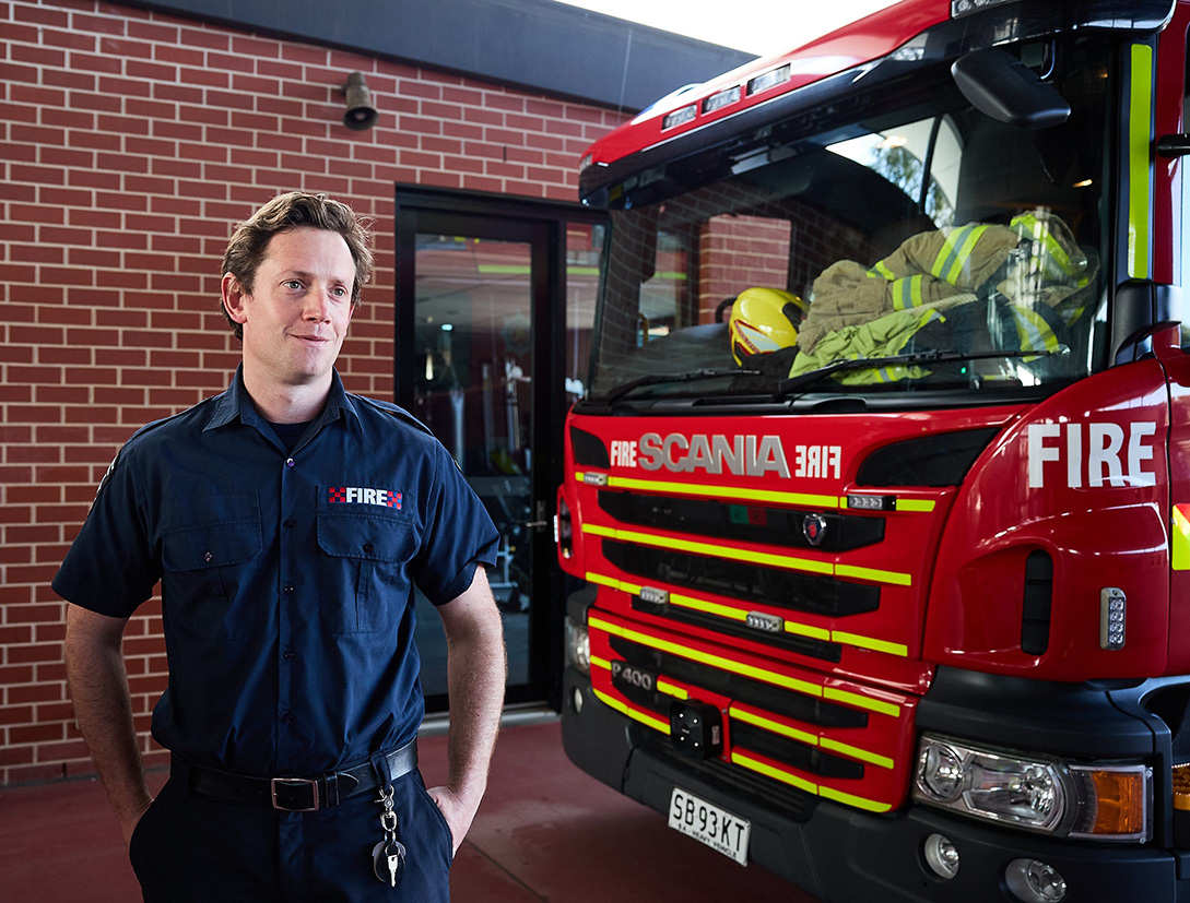 Close up image of MFS firefighter in corporate uniform.