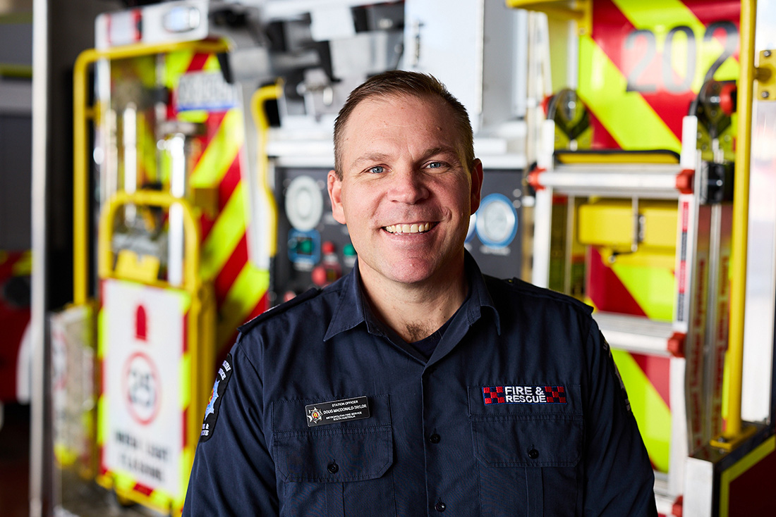 Close up image of MFS firefighter in corporate uniform.