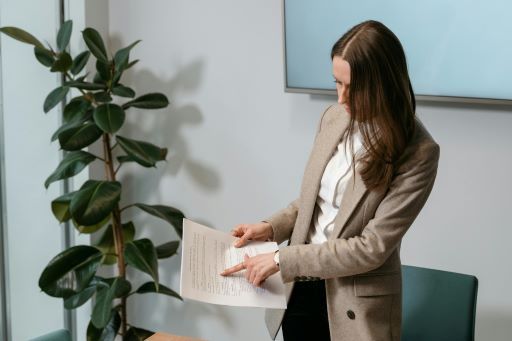 Woman reading a report document.